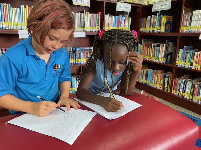 Children reading in a library