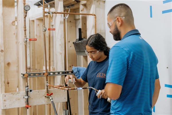 Plumbing apprentice students during a training session
