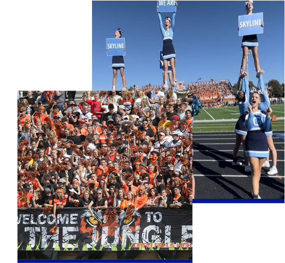 Cheerleaders smile and cheer next to a colorful sign that says Welcome to the Jungle.