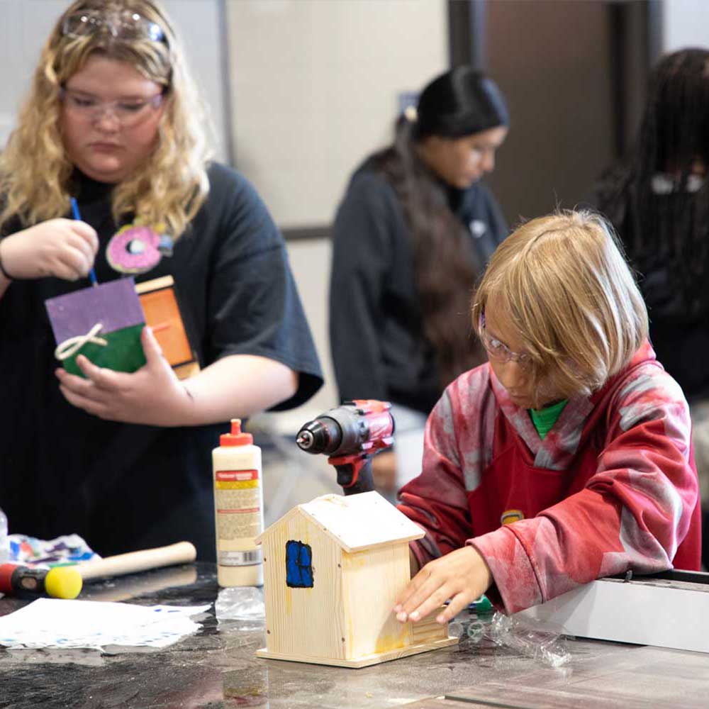 Kids building bird houses