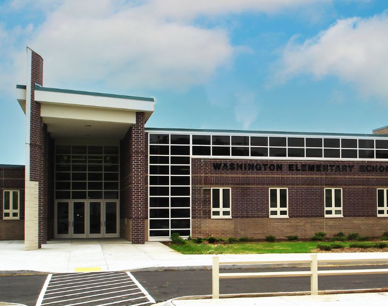 Washington Elementary School entrance with large windows and brick exterior