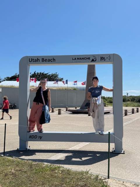 Student and teacher pictured in frame labeled Utah Beach.