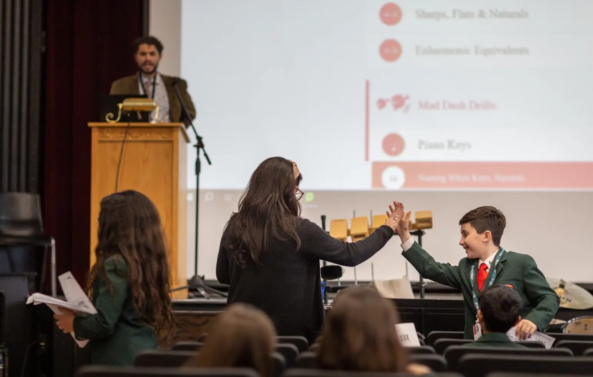 Teacher meeting with students.