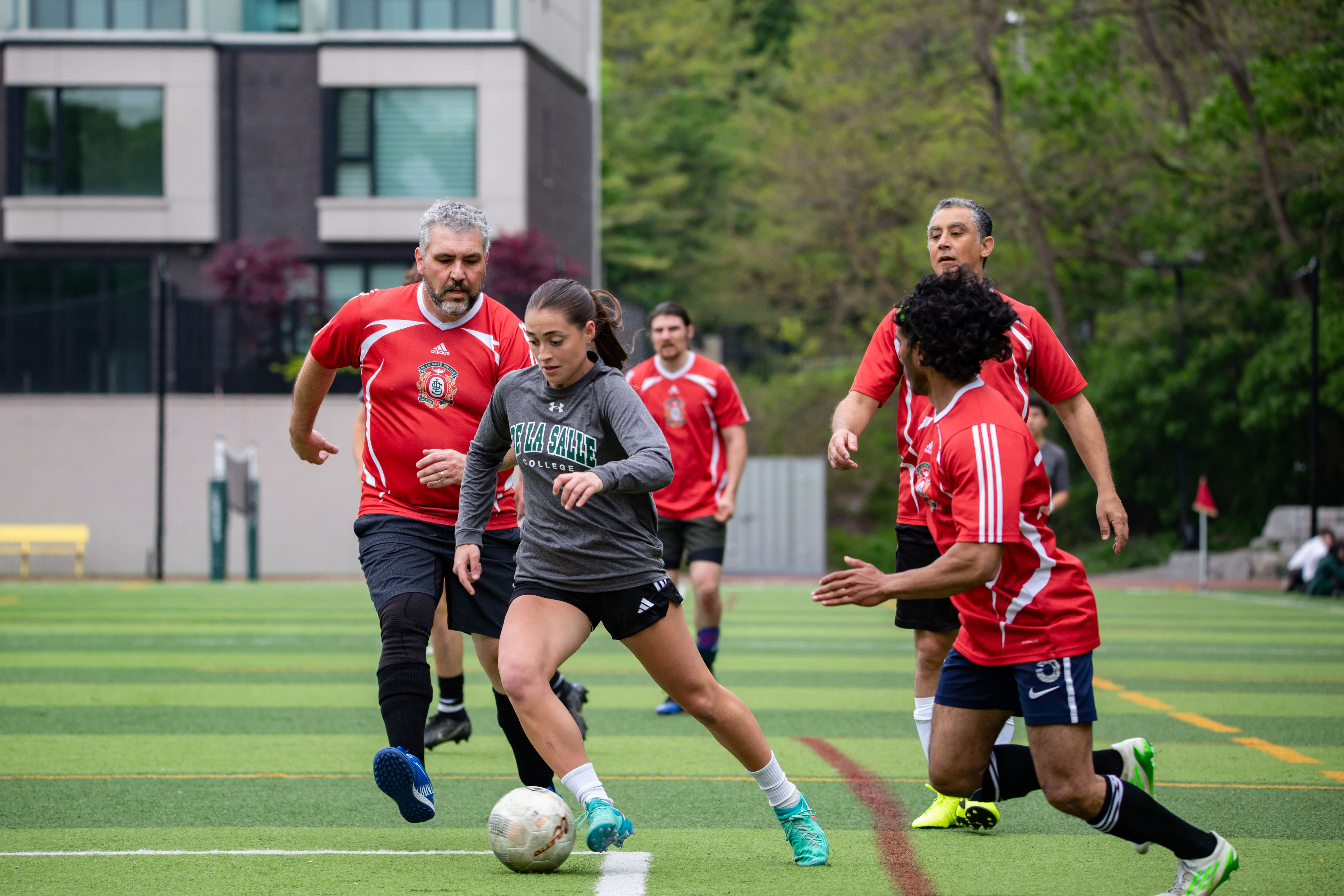 Athletes training on the turf field.