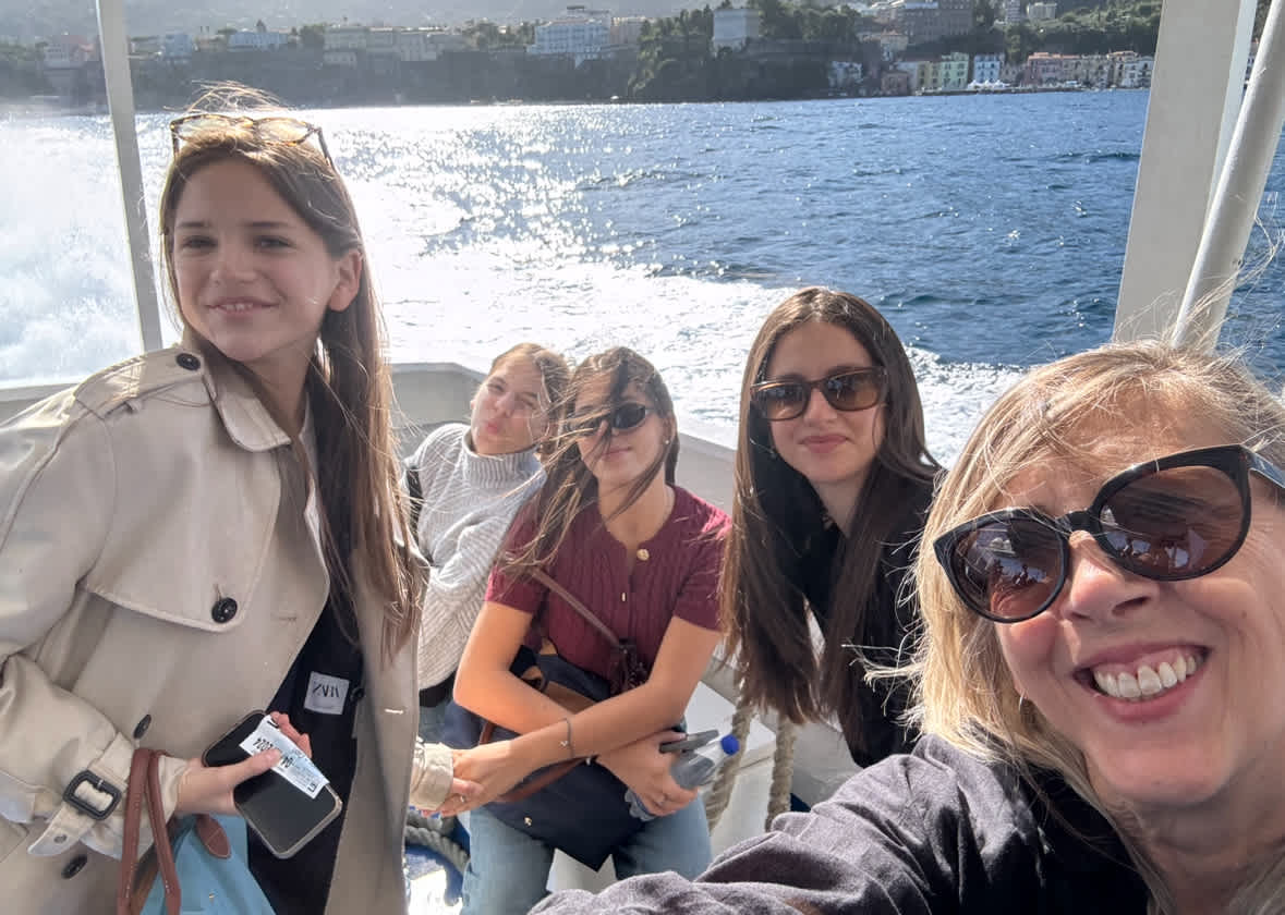 CCI students and a teacher on a boat along the Amalfi Coast