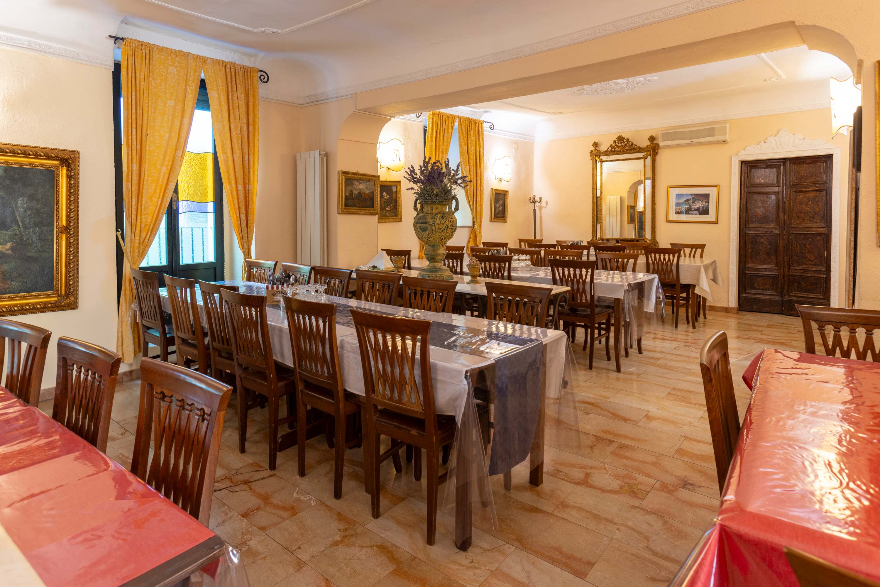 Tables prepared for students in Allegria's dining room