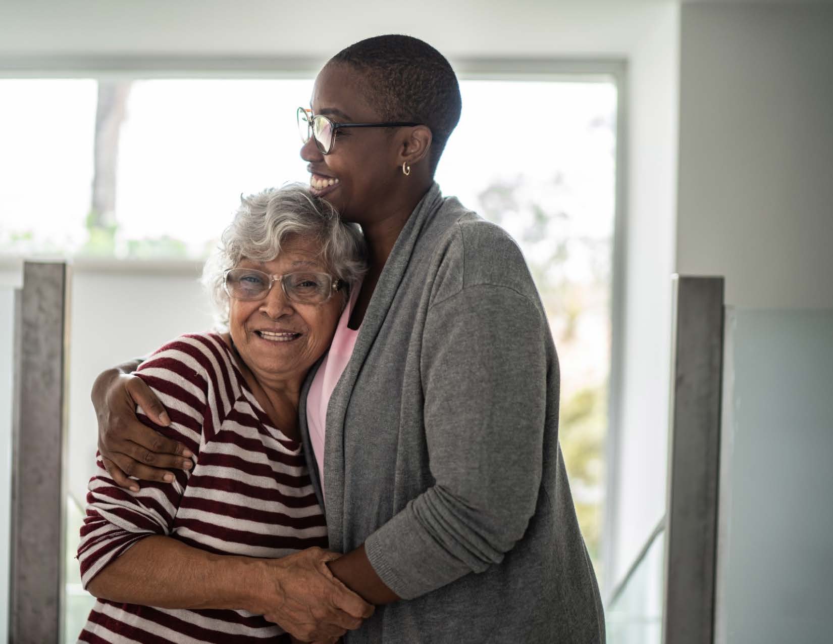 SLP Connect program participant and caregiver sharing a supportive moment at Misericordia University.