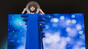 Students performing at Tet wearing traditional blue costumes.