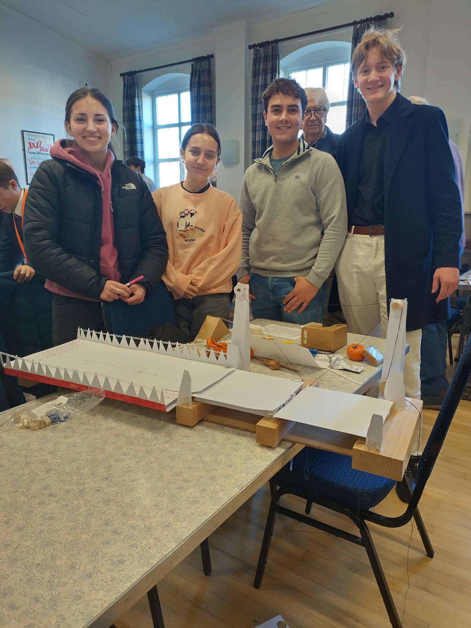 Students presenting their bridge design model during the Rotary Technology Tournament