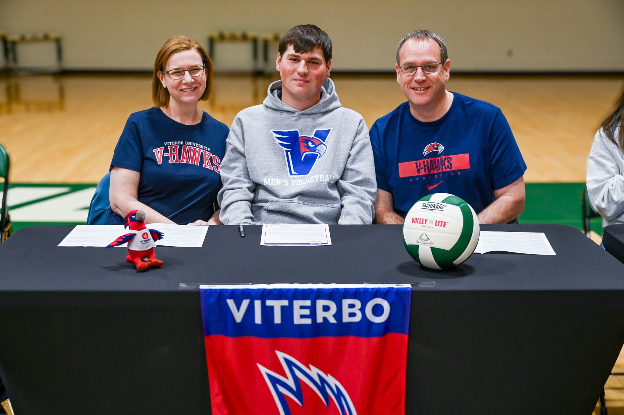 Holy Family senior Eli Sorkin signs to play college volleyball at Viterbo University with his family.