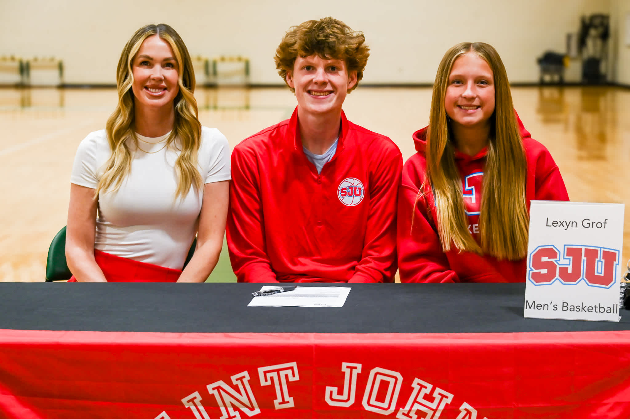 Holy Family senior Lexyn Grof signs to play college basketball at Saint John's University.
