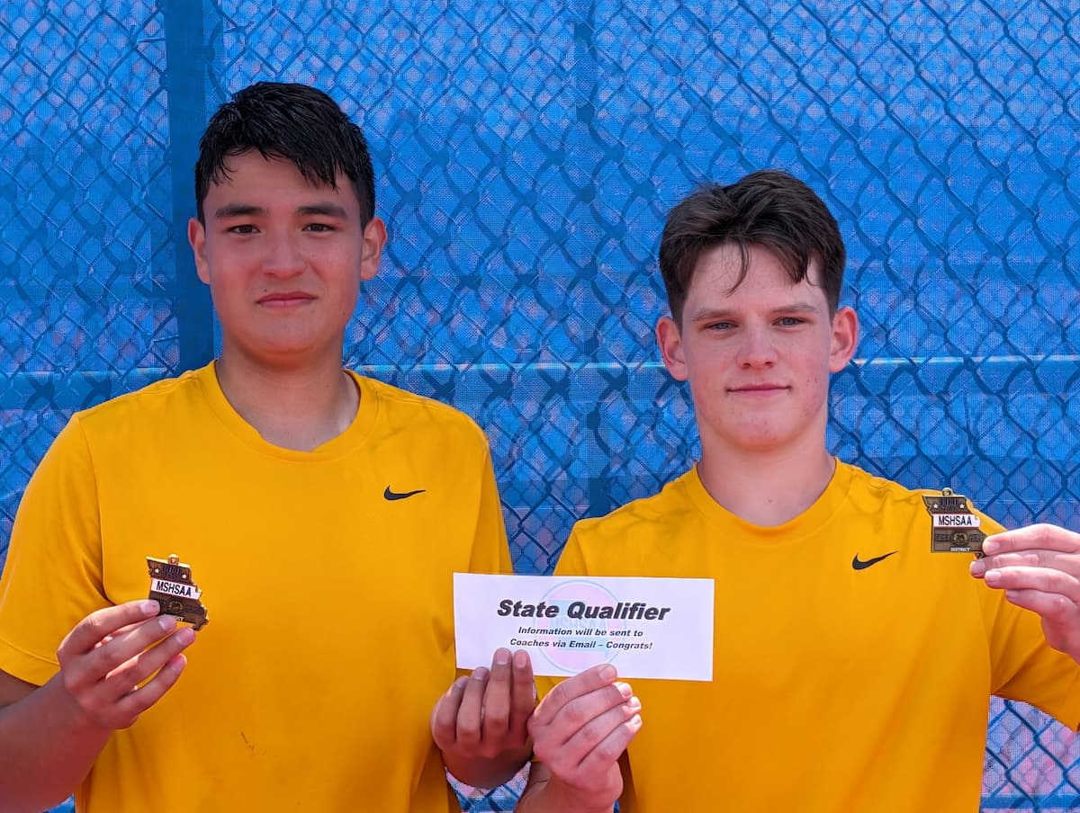 Cadets Scribner and Reyes hold their award after winning tennis districts.
