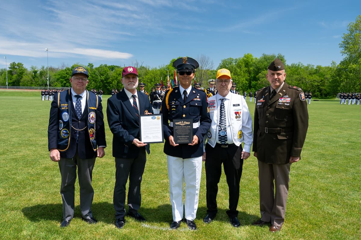 Cadet Heshun Xiao poses with veterans and military leaders after receiving the Silent Service Award during Missouri Military Academy’s Mother’s Day Review.