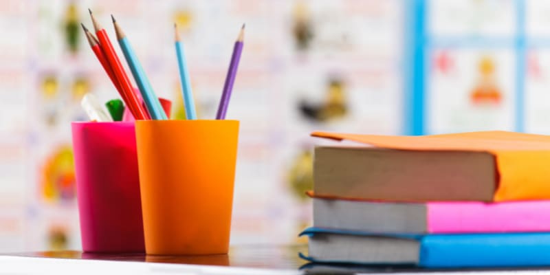Colored pencils and books