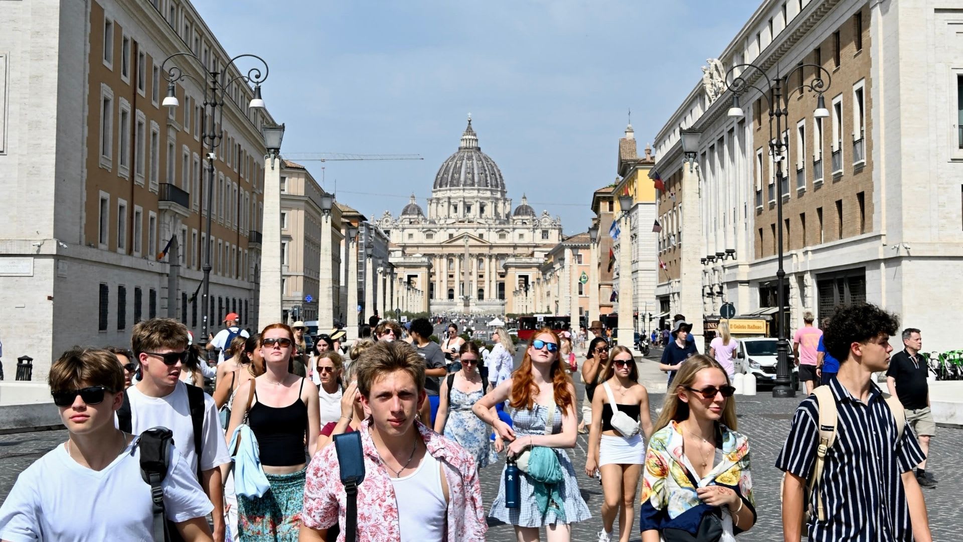 Summer Academy students walking through Rome with St Peter’s Basilica in the background