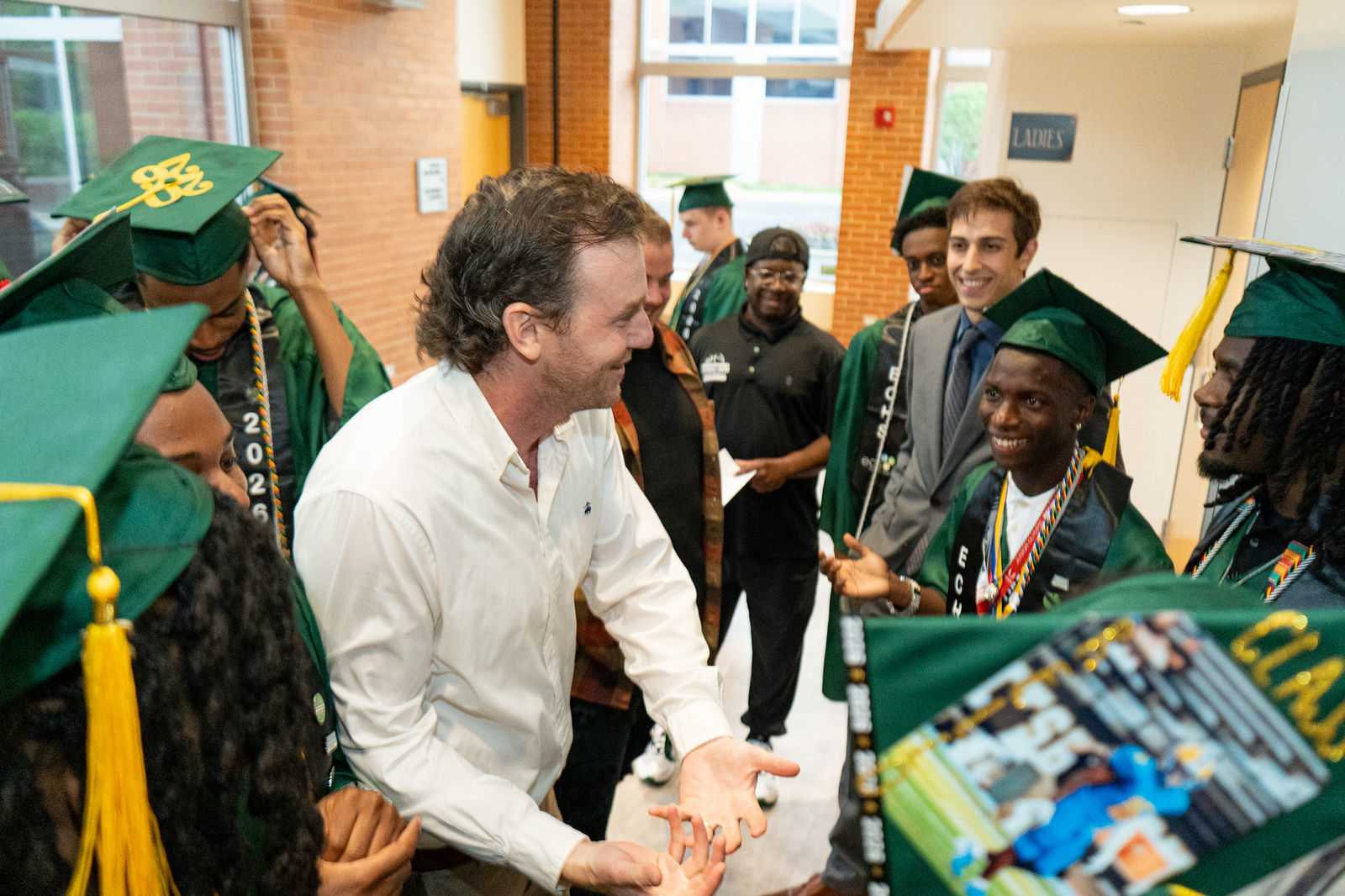 ECHS graduates being congratulated as they leave the ceremony
