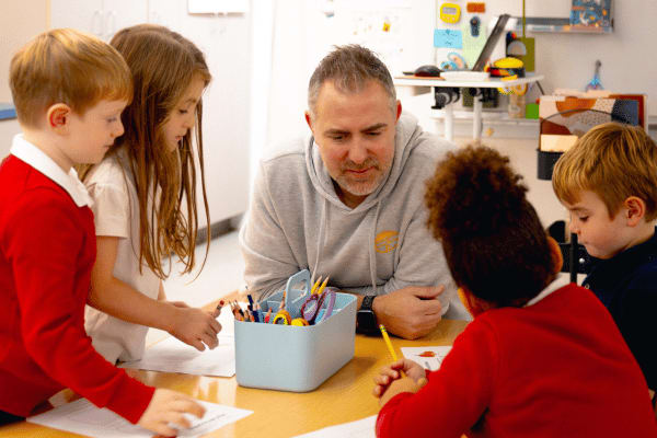 Epiphany School teacher working with a group of students