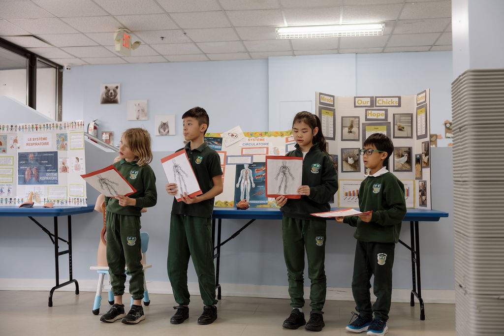 Giles School students presenting a class science project
