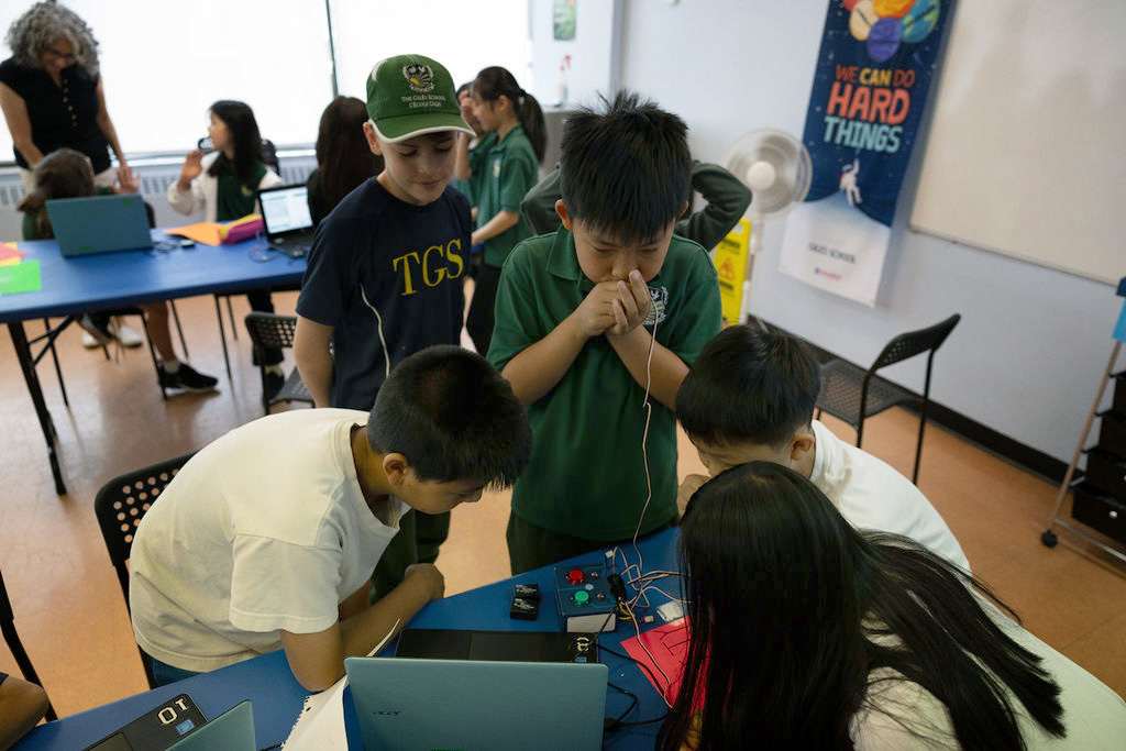 Giles School students working together on a robotics activity