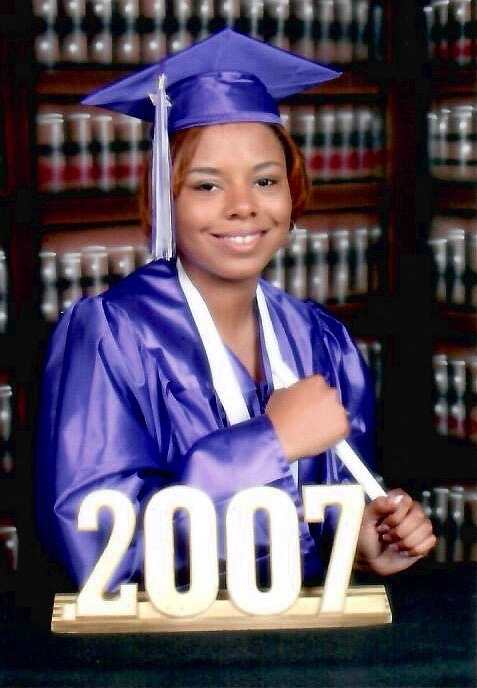 Chevelta Remo, valedictorian Class of 2006, poses for a graduation picture with her robe.