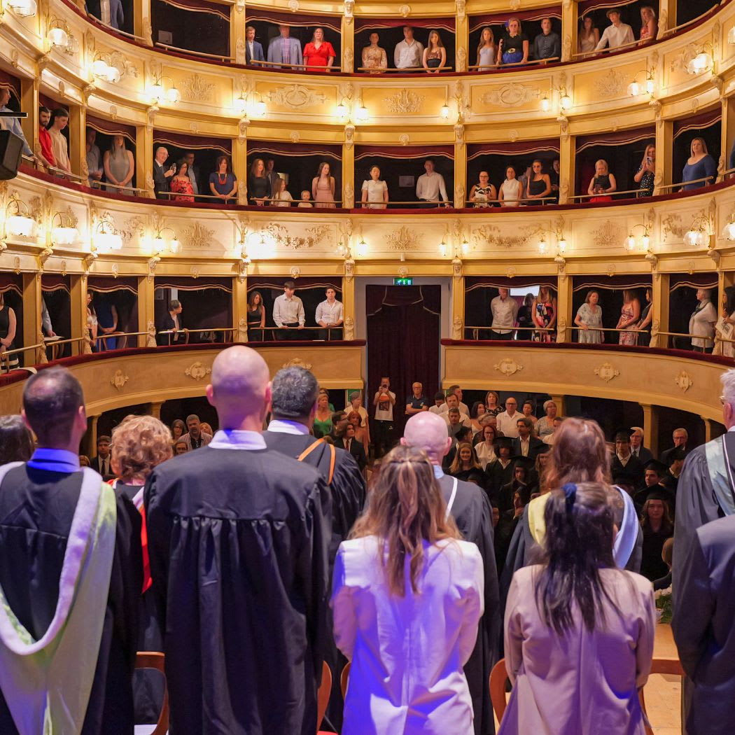 CCI graduates and families inside Lanciano's historic theatre