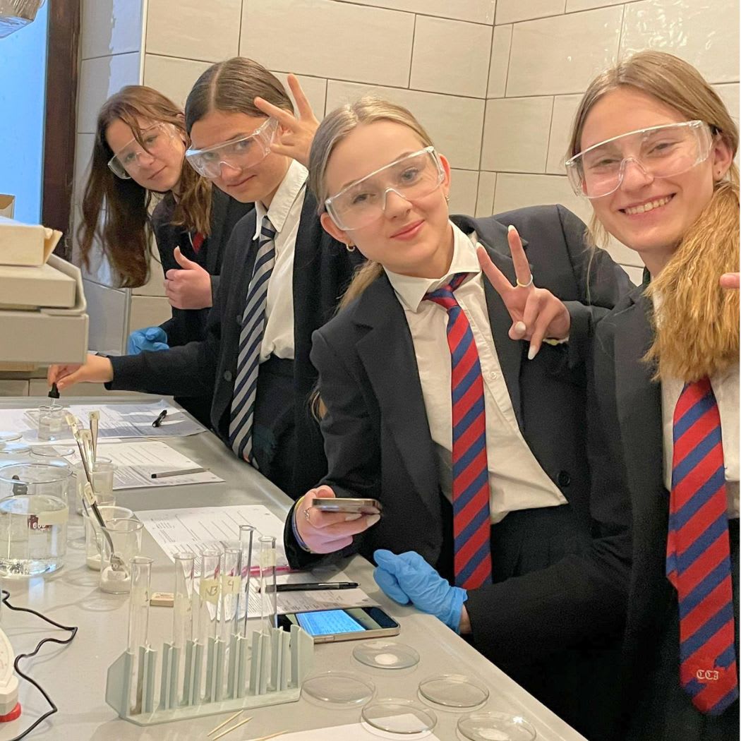 CCI students working together in the science laboratory