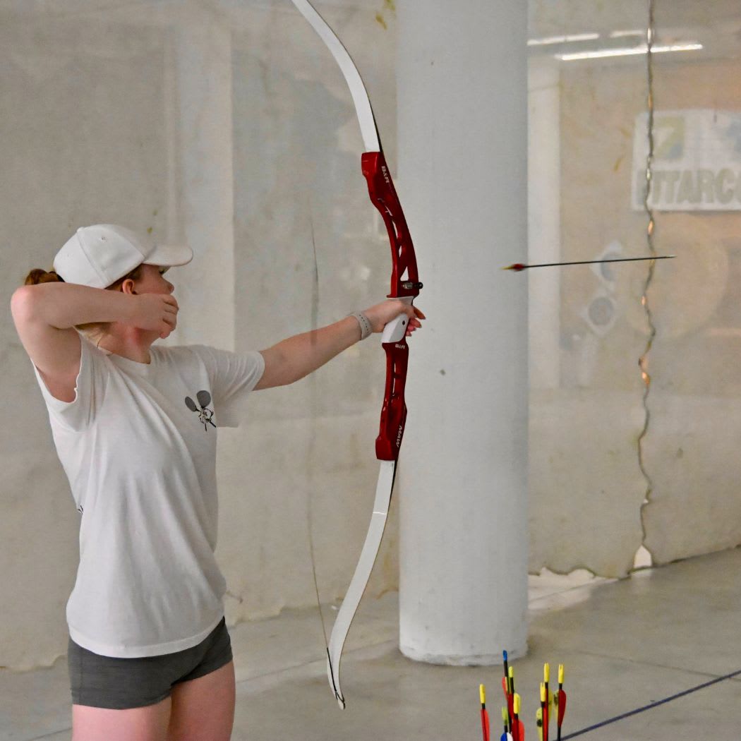 A CCI student practising archery indoors