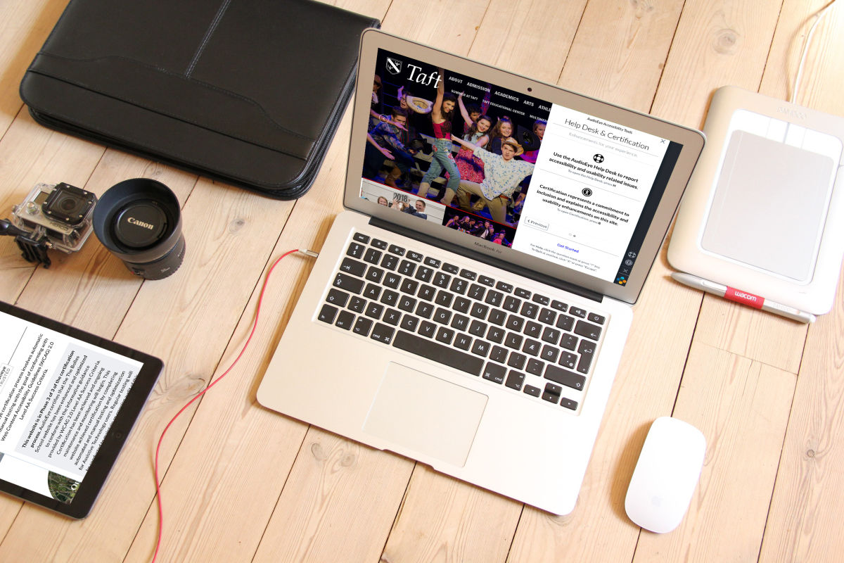 taft website in laptop on desk with ipad