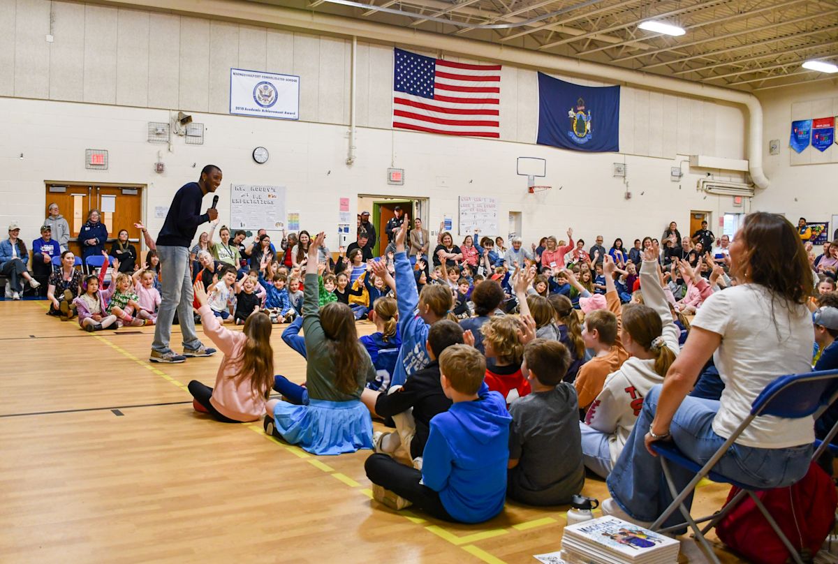 From Super Bowl champ to children's author: Malcolm Mitchell inspires young readers at KCS