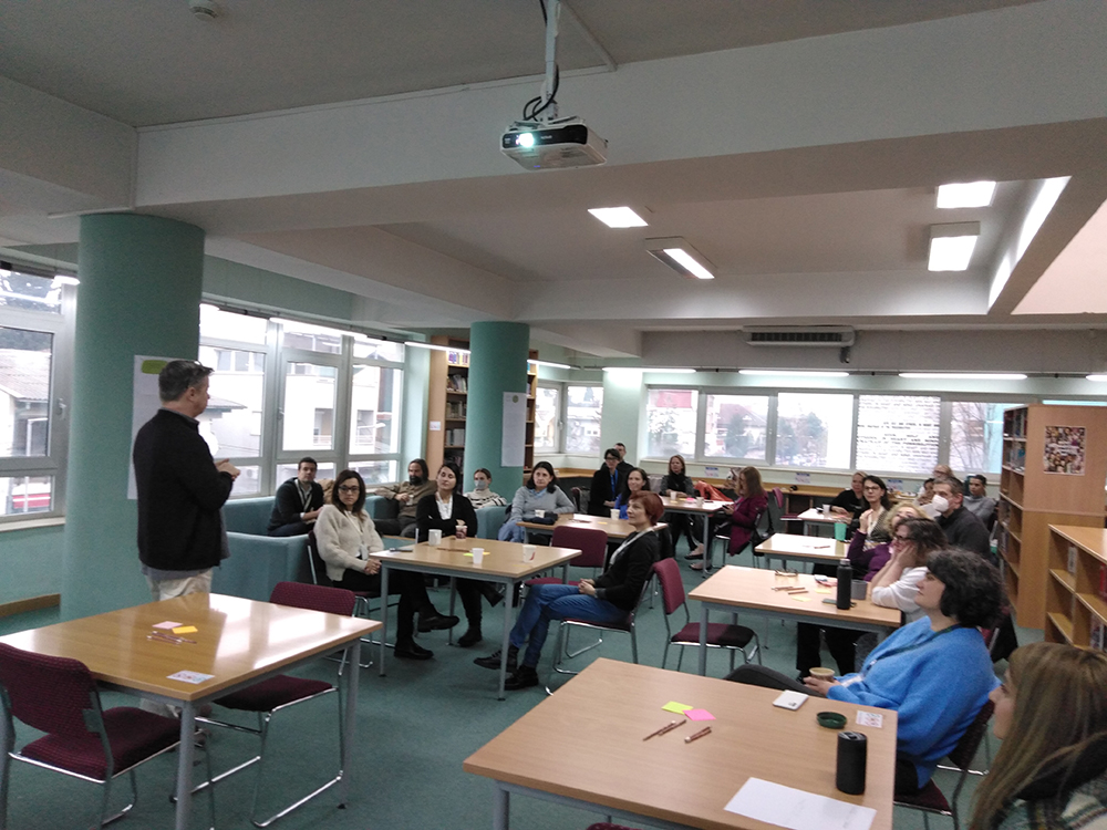 Parents attending a PTA coffee hour on stress management in the library