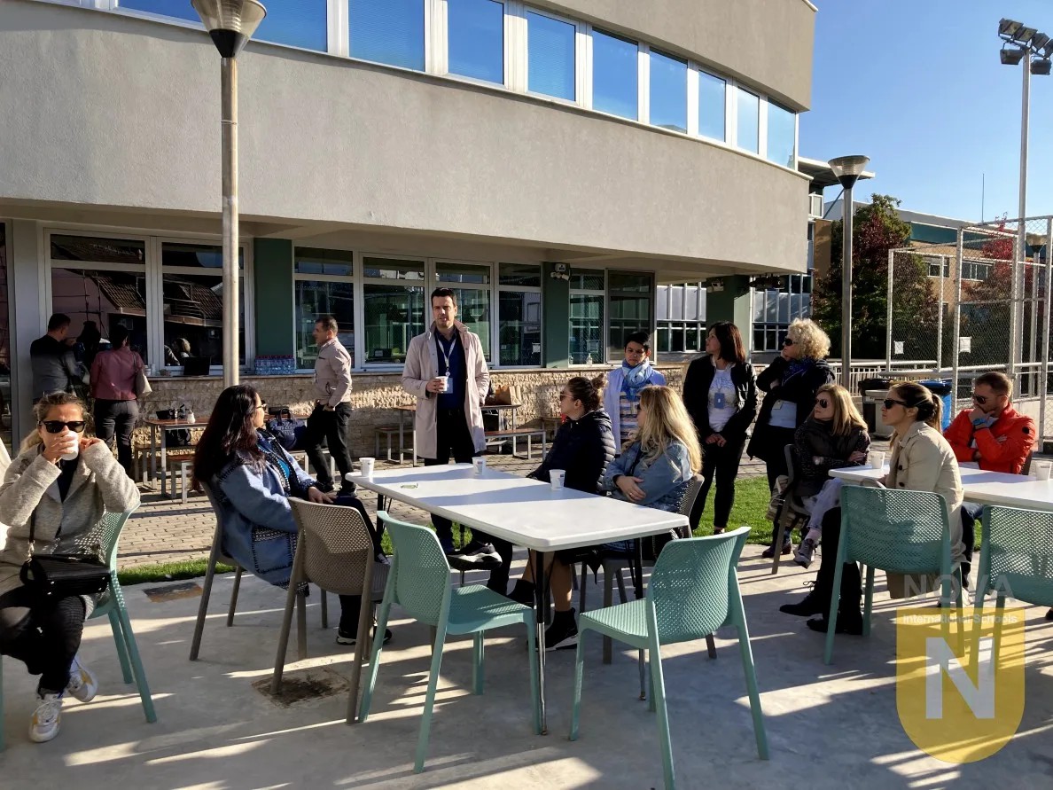 Parents seated outdoors at the PTA coffee morning general assembly