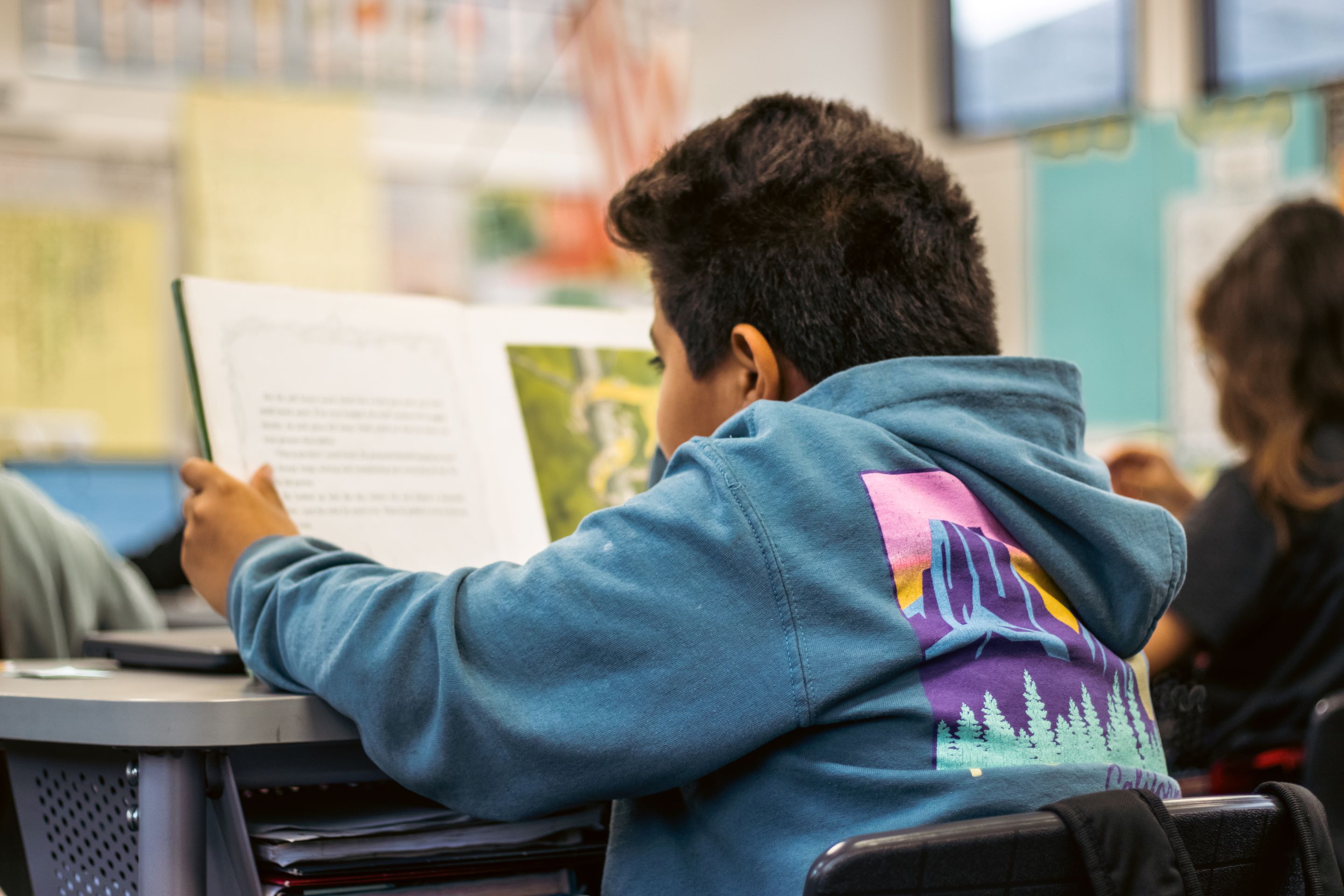 Student reading a book. 