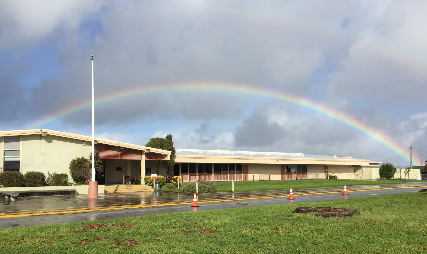 NMCMS campus with rainbow