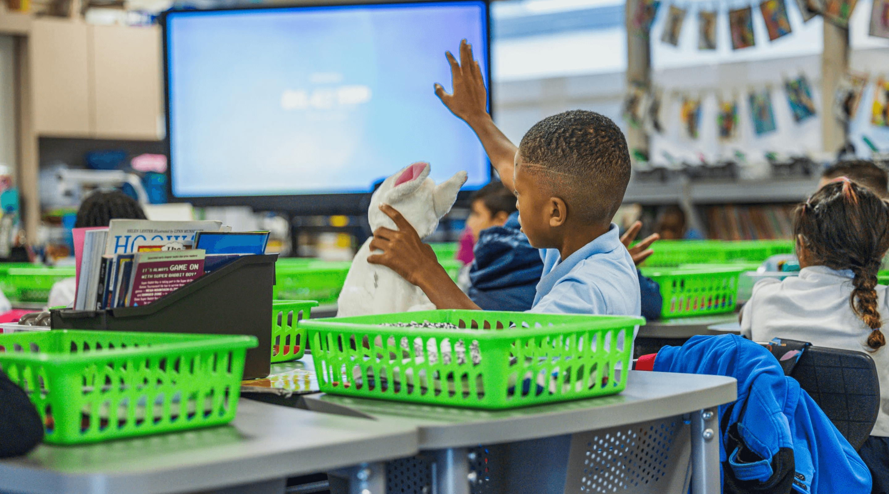 A student raises their hand during class.