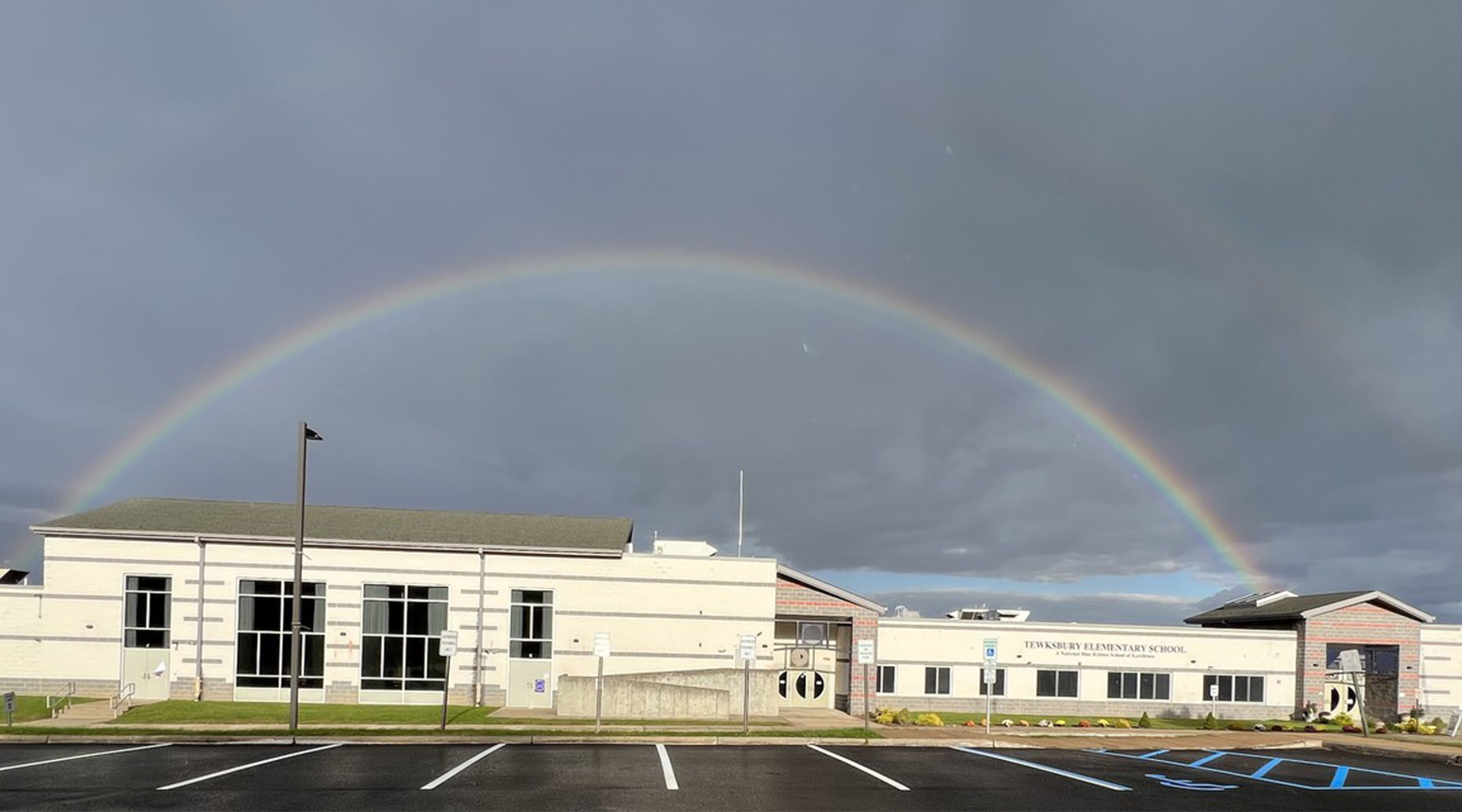 Front of building with rainbow above