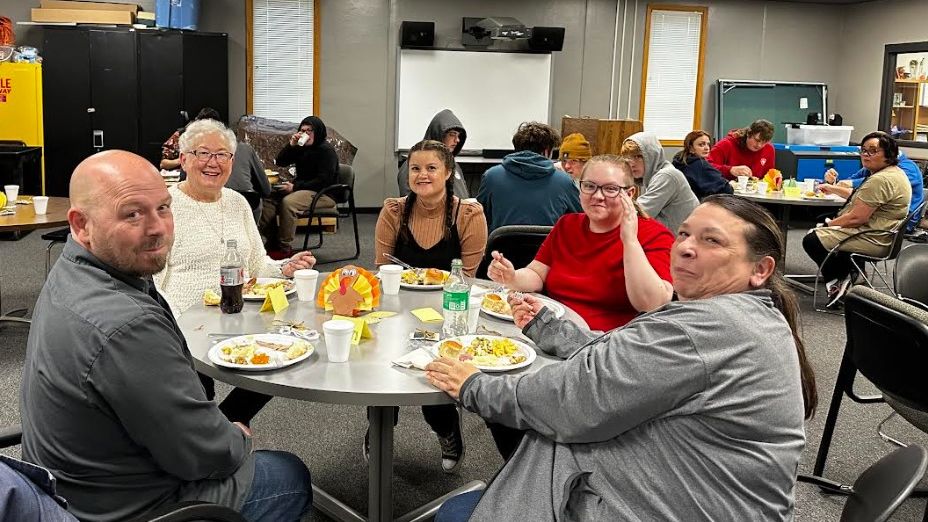Staff sharing Thanksgiving Meal