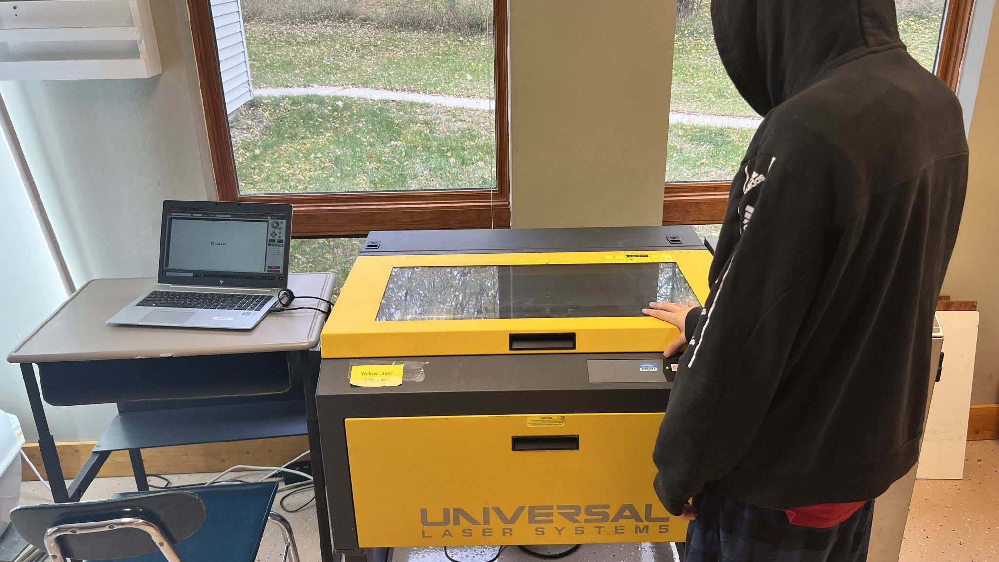Student Using Laser Engraver