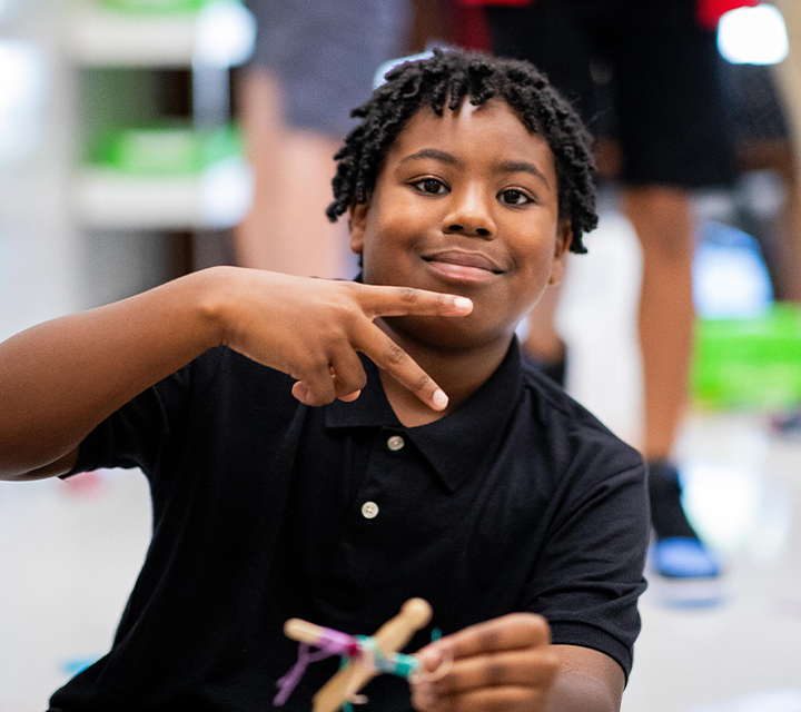 Student posing in classroom.