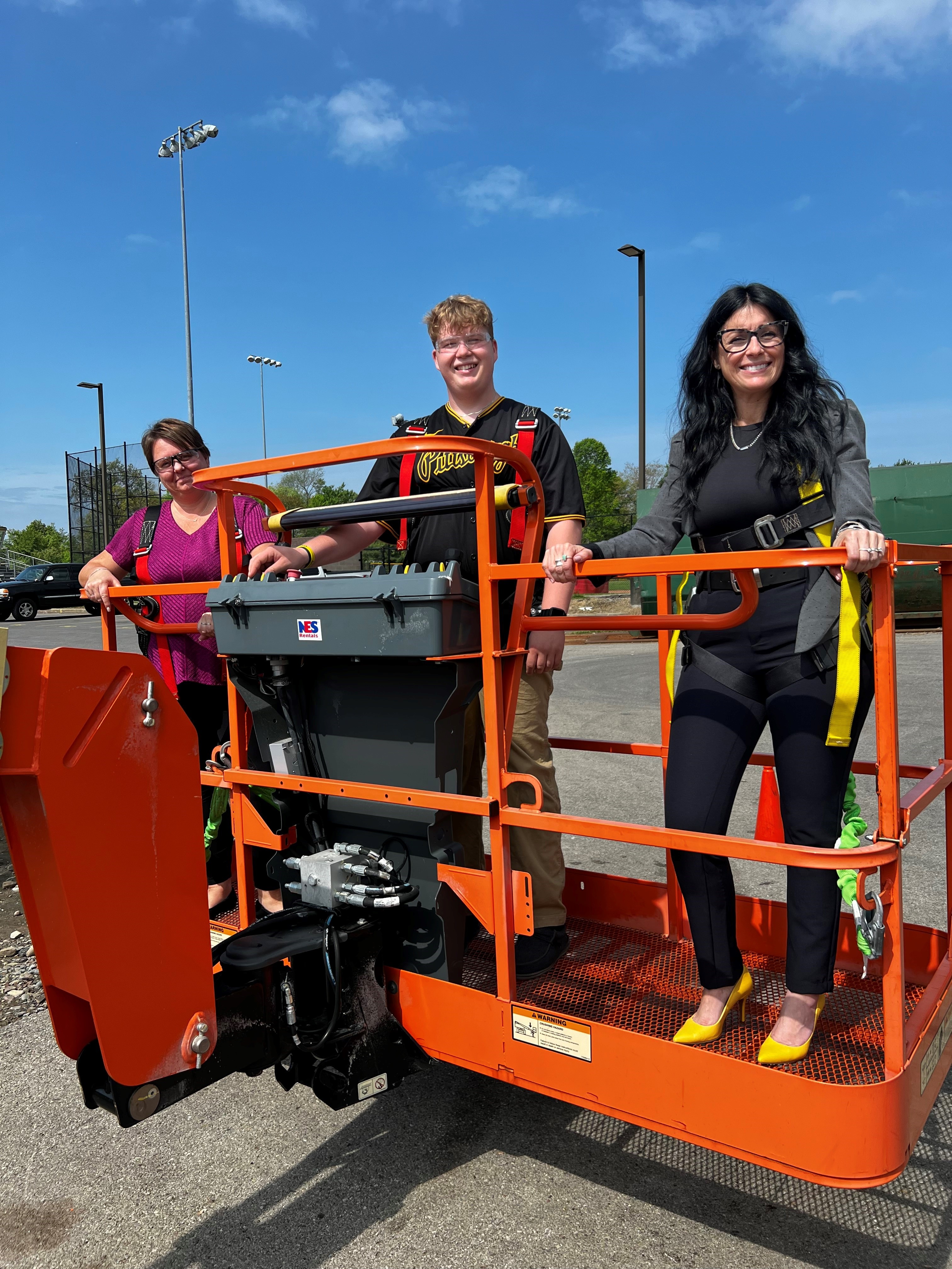 JLG Lift Mrs. Daniels-Wells, Nathan Aaron, & Dr. Hiler