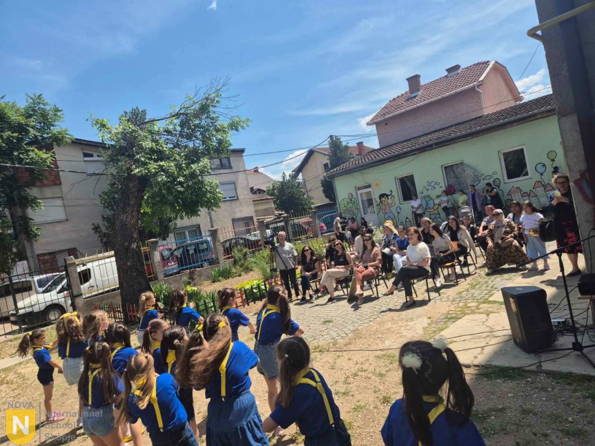 Students performing in the schoolyard during the donation visit in Kumanovo