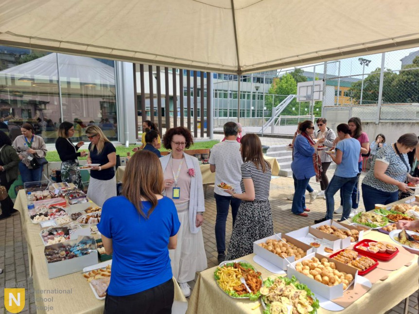 Faculty enjoying food at the PTA Teacher Appreciation Day buffet