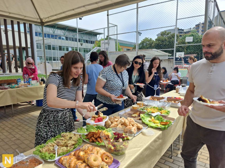 Faculty helping themselves to a buffet prepared by the PTA