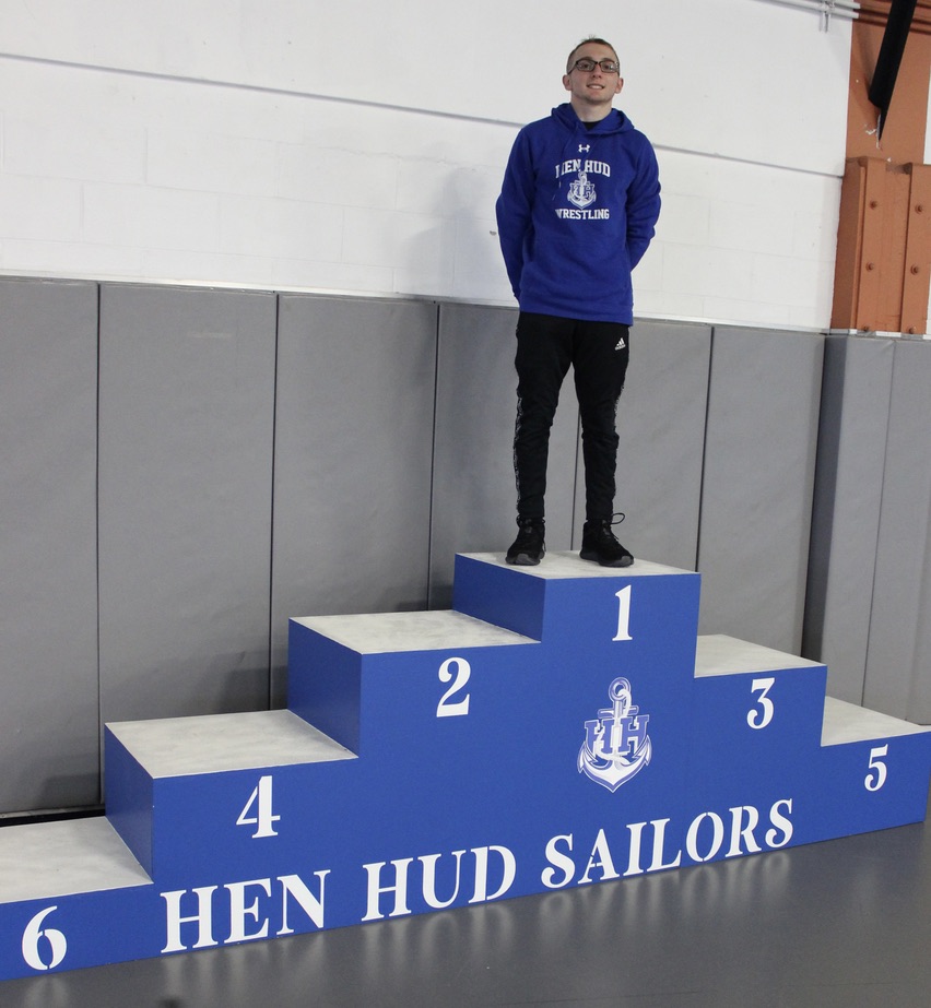 Hen Hud Wrestler Stands Atop Podium of His Own Making Post Details