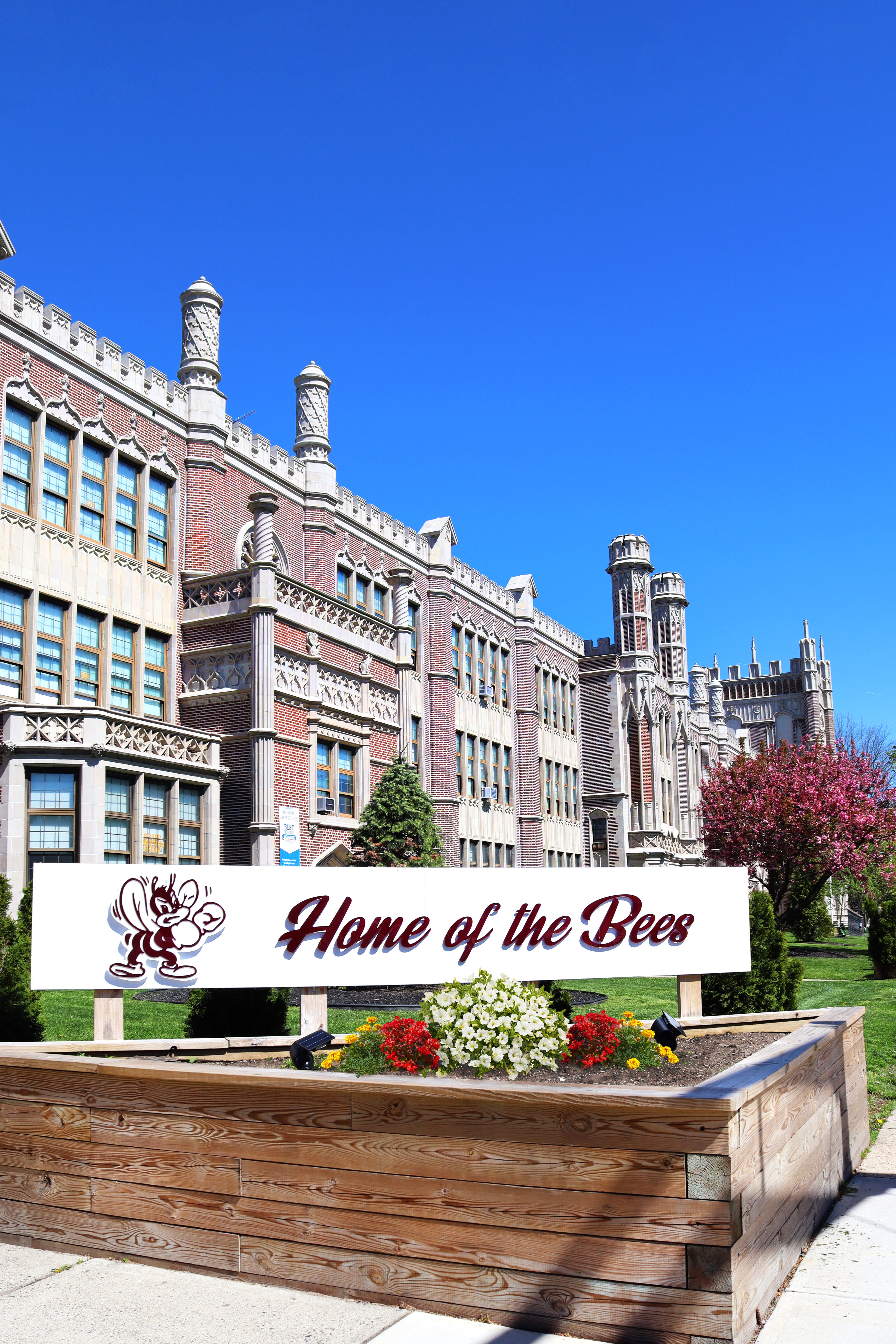Bayonne High School is displayed with a white sign that reads "Home of the Bees"