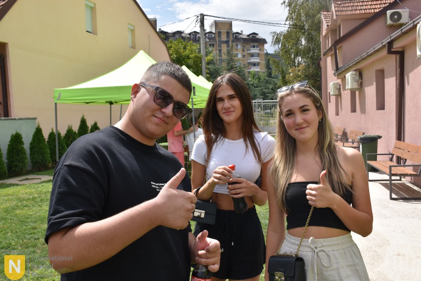 Three students giving a thumbs up at the BBQ social