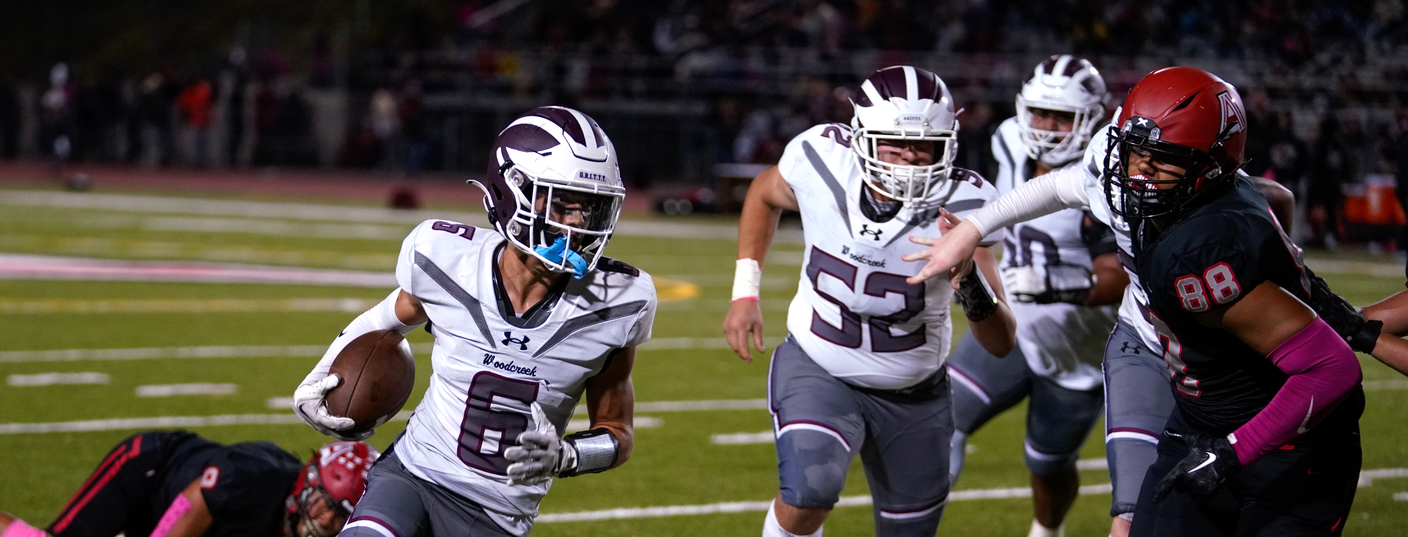 WHS Football player running with ball