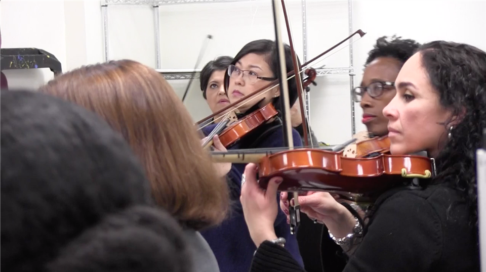 Parents playing violins