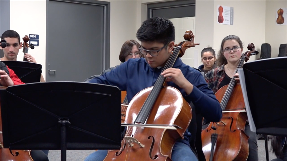 student playing cello