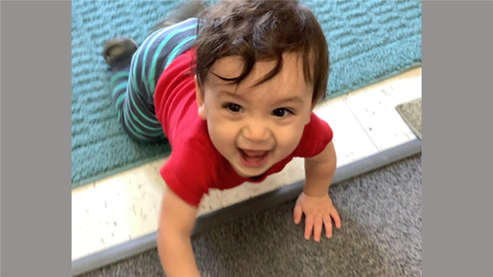 Child crawling and laughing