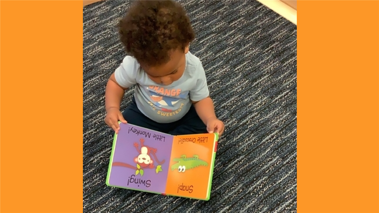 Child reading on the floor